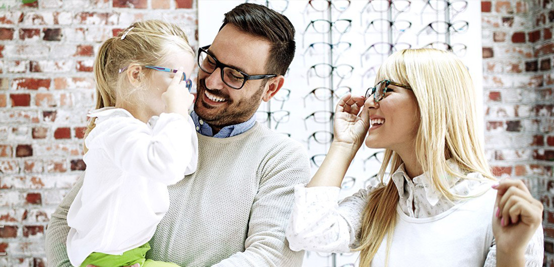 Family Trying On Eyeglasses
